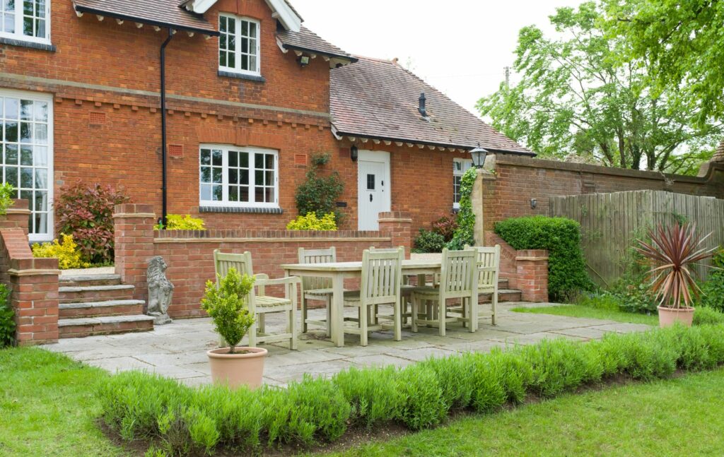 House and garden patio with furniture 